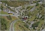 Die DFB (Dampfbahn Furka Bergstrecke) HG 4/4 704 verlässt mit ihrem Dampfzug 133 den 548 Meter langen Kehrtunnel  Gletsch  und überbrückt unmittelbar darauf die noch junge Rhone. 

30. Sept. 2021